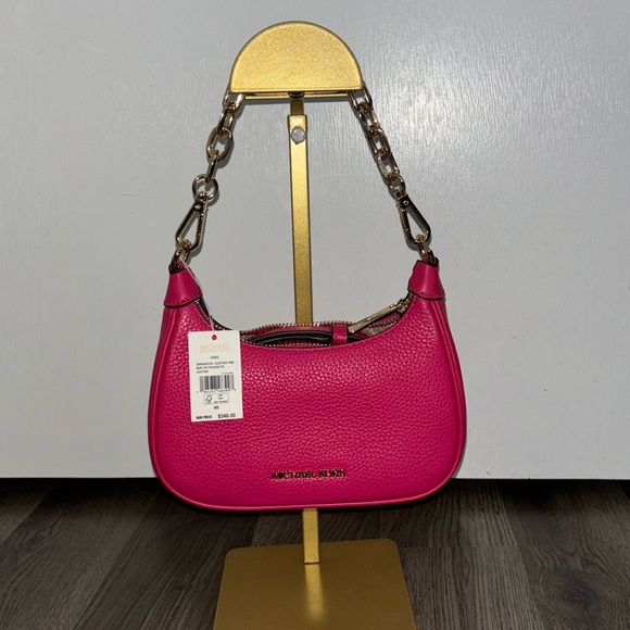 Michael Kors Handbags - SOLD 🚨🚨 NWT Michael Kors Mini Pouchette RETAIL $348